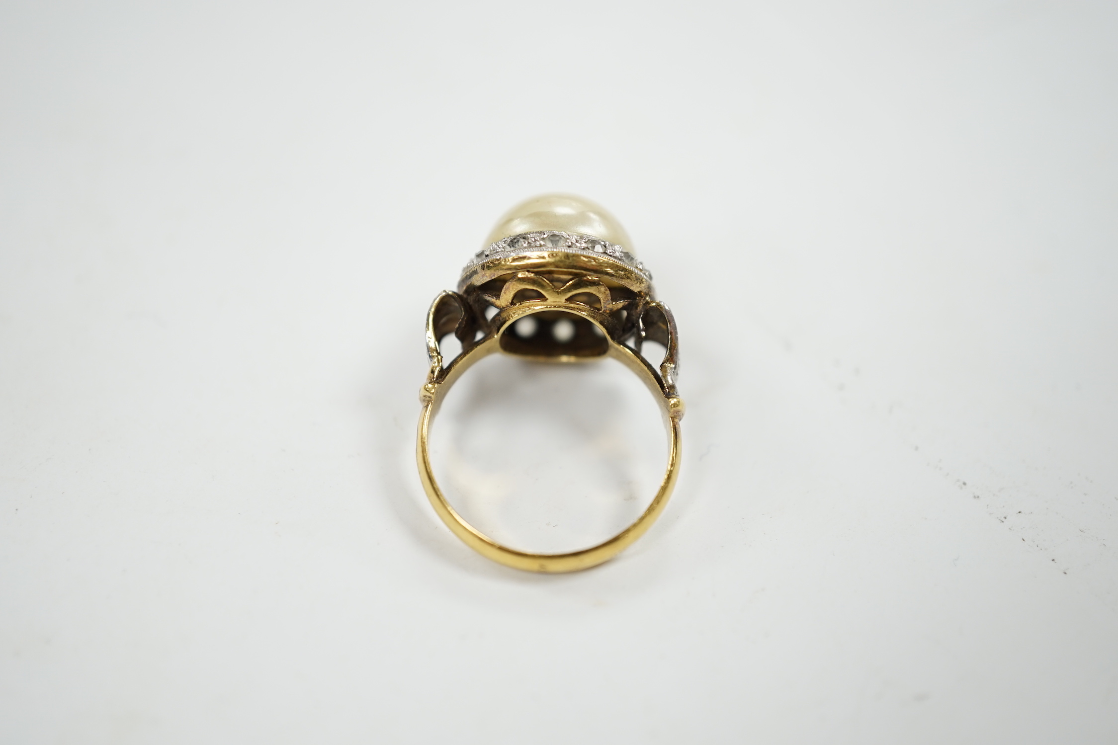 A yellow metal, simulated mabe pearl and paste set cluster ring, size O, gross weight 4.6 grams.